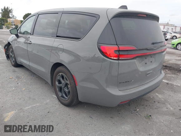2023 Chrysler Pacifica Hybrid Touring L with VIN 2C4RC1L71PR584485, listed as a IAAI auction lot 42056423 with 58,955 mi miles and . Bid and sale history available at DreamBid. Image 3.