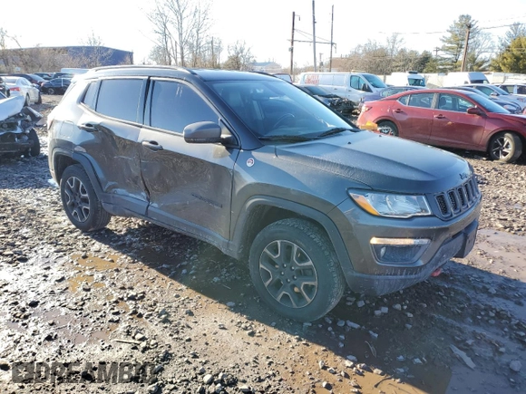 2019 Jeep Compass Trailhawk with VIN 3C4NJDDB5KT775860, listed as a Copart auction lot 48113695 with 76,091 mi miles and Salvage Title. Bid and sale history available at DreamBid. Image 4.