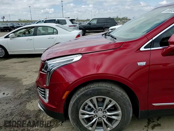 2023 Cadillac XT5 FWD Premium Luxury z VIN 1GYKNCRS5PZ173528, wystawiony jako Copart lot #55805605 z przebiegiem 7 789 mil mil oraz Szkoda całkowita • Salvage title. Historia ofert i sprzedaży dostępna na DreamBid. Obrazek 14.