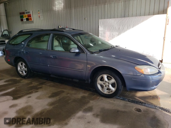 2001 Ford Taurus SE Standard with VIN 1FAHP58S71G184725, listed as a Copart auction lot 56401895 with 163,238 mi miles and Salvage title. Bid and sale history available at DreamBid. Image 4.