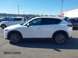 2021 Mazda CX-5 Grand Touring with VIN JM3KFBDM6M0483135, listed as a IAAI auction lot 41590430 with 33,466 mi miles. Bid and sale history available at carsss.com. Image 14.