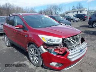 2017 Ford Escape Titanium with VIN 1FMCU0JD9HUC71738, listed as a IAAI auction lot 41673228 with 173,615 mi miles. Bid and sale history available at carsss.com. Image 1.