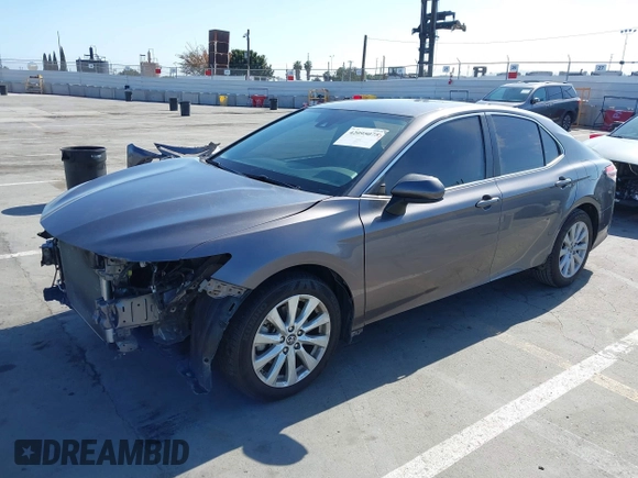 2019 Toyota Camry LE with VIN 4T1B11HK2KU240465, listed as a IAAI auction lot 42095075 with 67,852 mi miles and . Bid and sale history available at DreamBid. Image 2.