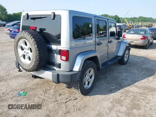 2015 Jeep Wrangler Unlimited Sahara with VIN 1C4BJWEG9FL570780, listed as a IAAI auction lot 42474940 with 116,226 mi miles and . Bid and sale history available at DreamBid. Image 4.
