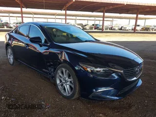 2016 Mazda Mazda6 i Touring with VIN JM1GJ1T5XG1434388, listed as a IAAI auction lot 41528124 with 99,293 mi miles. Bid and sale history available at carsss.com. Image 1.