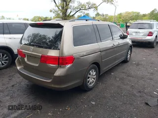 2009 Honda Odyssey EX-L with VIN 5FNRL38759B022866, listed as a IAAI auction lot 42200965 with 145,641 mi miles and . Bid and sale history available at DreamBid. Image 4.