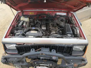 1993 Jeep Cherokee Sport with VIN 1J4FJ67S6PL580133, listed as a Copart auction lot 43230005 with 122,173 mi miles and Salvage Title. Bid and sale history available at carsss.com. Image 12.