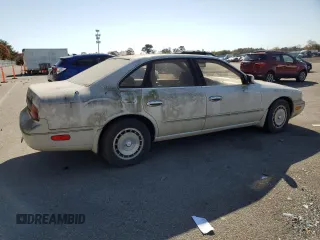 1994 Infiniti Q45 z VIN JNKNG01D3RM252218, wystawiony jako Copart lot #77230944 z przebiegiem 69 069 mil mil oraz Tytuł czysty. Historia ofert i sprzedaży dostępna na DreamBid. Obrazek 3.