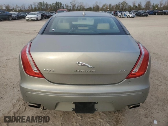 2014 Jaguar XJ with VIN SAJWA2GZ8E8V60138, listed as a Copart auction lot 86384064 with 137,190 mi miles and Salvage Title. Bid and sale history available at carsss.com. Image 6.