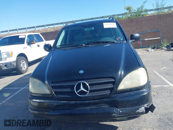 2001 Mercedes-Benz M-Class with VIN 4JGAB54E01A272539, listed as a IAAI auction lot 42124321 with 272,098 mi miles. Bid and sale history available at carsss.com. Image 12.