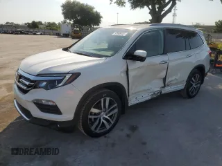 2017 Honda Pilot Touring with VIN 5FNYF5H99HB029687, listed as a Copart auction lot 57609445 with 34,530 mi miles and Salvage title. Bid and sale history available at DreamBid. Image 1.