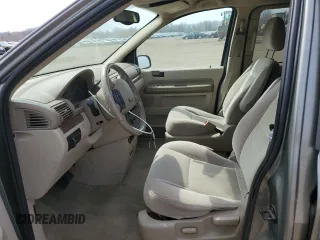 2004 Ford Freestar SEL z VIN 2FMZA52284BA84276, wystawiony jako Copart lot #53475915 z przebiegiem 152 999 mil mil oraz Tytuł czysty. Historia ofert i sprzedaży dostępna na DreamBid. Obrazek 7.