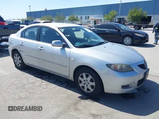 2008 Mazda 3 i Touring *Ltd Avail with VIN JM1BK12GX81184839, listed as a IAAI auction lot 41969238 with 197,387 mi miles. Bid and sale history available at carsss.com. Image 1.