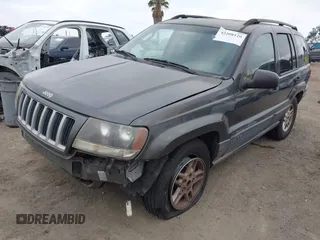 2004 Jeep Grand Cherokee Laredo with VIN 1J4GX48S34C214485, listed as a IAAI auction lot 42208120 with 164,322 mi miles and . Bid and sale history available at DreamBid. Image 2.