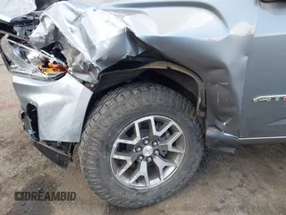 2021 GMC Canyon 4WD AT4 z VIN 1GTG6FEN8M1275345, wystawiony jako IAAI lot #42045878 z przebiegiem 68 299 mil mil oraz . Historia ofert i sprzedaży dostępna na DreamBid. Obrazek 17.