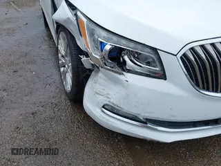 2014 Buick LaCrosse Premium II with VIN 1G4GF5G39EF305460, listed as a IAAI auction lot 41951229 with 127,188 mi miles and . Bid and sale history available at DreamBid. Image 6.