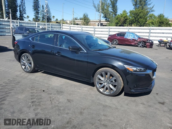 2021 Mazda 6 Touring with VIN JM1GL1VM7M1614986, listed as a Copart auction lot 83183424 with 38,168 mi miles and Salvage Title. Bid and sale history available at DreamBid. Image 4.
