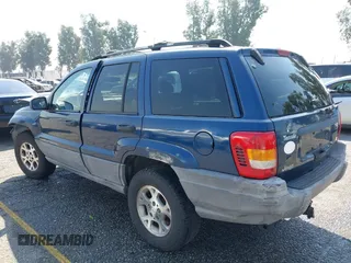 1999 Jeep Grand Cherokee Laredo z VIN 1J4G258S1XC787295, wystawiony jako IAAI lot #40450680 z przebiegiem Nie podano mil oraz . Historia ofert i sprzedaży dostępna na DreamBid. Obrazek 3.