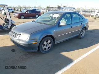 2004 Volkswagen Jetta GL z VIN 3VWRA69M64M044291, wystawiony jako IAAI lot #41882666 z przebiegiem 205 029 mil mil oraz . Historia ofert i sprzedaży dostępna na DreamBid. Obrazek 2.