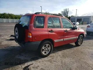 2003 Chevrolet Tracker z VIN 2CNBE13CX36943395, wystawiony jako Copart lot #70964574 z przebiegiem 118 975 mil mil oraz Szkody całkowita. Historia ofert i sprzedaży dostępna na DreamBid. Obrazek 3.