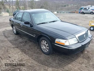 2005 Mercury Grand Marquis LS Premium z VIN 2MEFM75W65X671622, wystawiony jako IAAI lot #41958287 z przebiegiem 154 662 mil mil oraz . Historia ofert i sprzedaży dostępna na DreamBid. Obrazek 1.