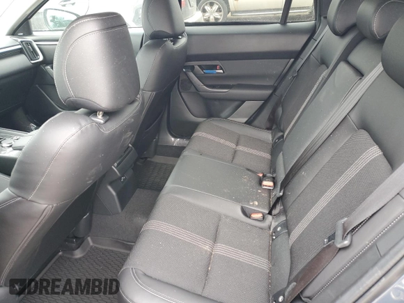 2025 Mazda CX-50 S Premium z VIN 7MMVABDM9SN322170, wystawiony jako Copart lot #85856354 z przebiegiem 1 774 mil mil oraz Czysty tytuł • Clean title. Historia ofert i sprzedaży dostępna na DreamBid. Obrazek 11.