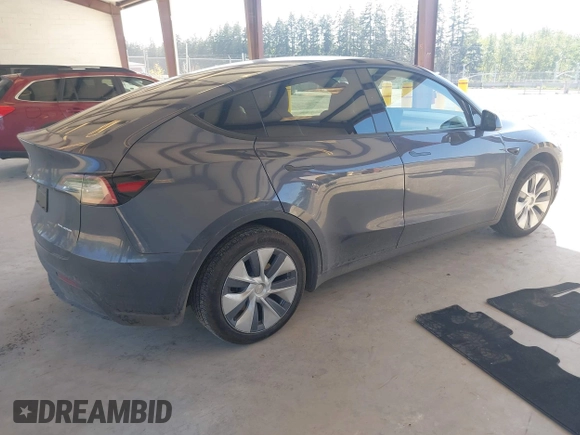 2023 Tesla Model Y Long Range with VIN 7SAYGAEE4PF906577, listed as a IAAI auction lot 42174987 with 13,260 mi miles and . Bid and sale history available at DreamBid. Image 4.