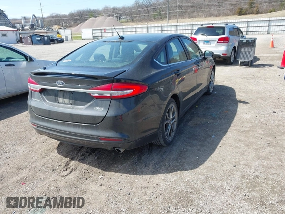 2017 Ford Fusion S with VIN 3FA6P0G71HR347881, listed as a IAAI auction lot 41911834 with 173,508 mi miles. Bid and sale history available at carsss.com. Image 4.