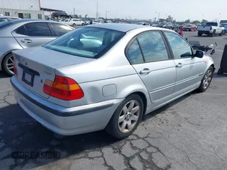 2002 BMW 3 Series 325i with VIN WBAET37492NG83135, listed as a IAAI auction lot 42028502 with 184,216 mi miles. Bid and sale history available at carsss.com. Image 4.