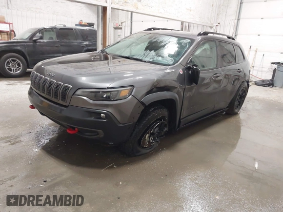 2022 Jeep Cherokee Trailhawk z VIN 1C4PJMBX9ND514703, wystawiony jako IAAI lot #41761037 z przebiegiem 38 499 mil mil oraz . Historia ofert i sprzedaży dostępna na DreamBid. Obrazek 17.