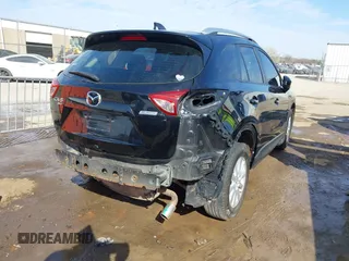 2014 Mazda CX-5 Sport with VIN JM3KE4BE6E0388909, listed as a IAAI auction lot 41876514 with 196,882 mi miles. Bid and sale history available at carsss.com. Image 4.