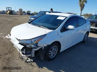 2021 Toyota Prius L Eco with VIN JTDKAMFU7M3148089, listed as a IAAI auction lot 41614915 with 119,725 mi miles. Bid and sale history available at carsss.com. Image 20.