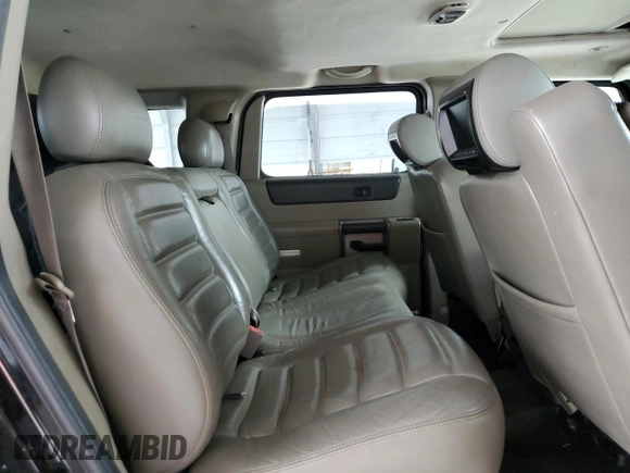 2003 Hummer H2 with VIN 5GRGN23U33H118459, listed as a Copart auction lot 77765694 with 157,390 mi miles and Salvage Title. Bid and sale history available at carsss.com. Image 11.
