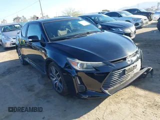 2014 Scion tC with VIN JTKJF5C79E3080678, listed as a IAAI auction lot 41756456 with 77,311 mi miles. Bid and sale history available at carsss.com. Image 1.