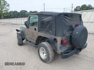 2003 Jeep Wrangler SE with VIN 1J4FA29113P304250, listed as a IAAI auction lot 40917099 with 191,589 mi miles. Bid and sale history available at carsss.com. Image 3.