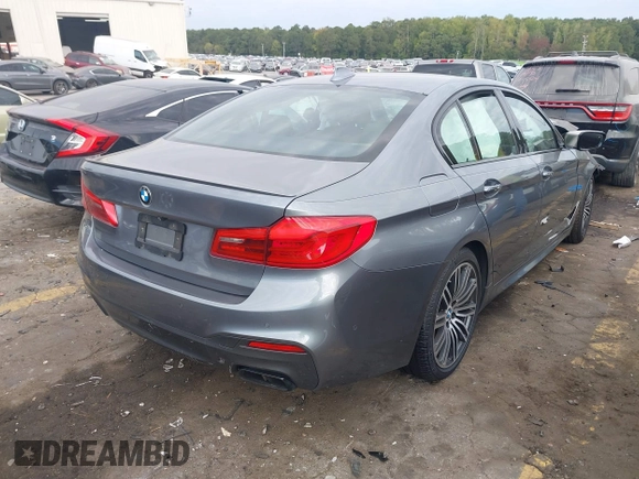 2018 BMW 5 Series M550i xDrive with VIN WBAJB9C53JB286035, listed as a IAAI auction lot 40590380 with 57,072 mi miles and . Bid and sale history available at carsss.com. Image 4.