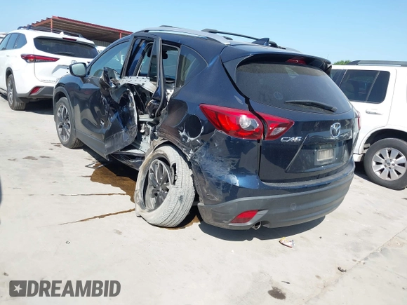 2016 Mazda CX-5 Grand Touring z VIN JM3KE2DY3G0797321, wystawiony jako IAAI lot #42017174 z przebiegiem 65 505 mil mil oraz . Historia ofert i sprzedaży dostępna na DreamBid. Obrazek 3.