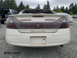 2002 Pontiac Bonneville SE z VIN 1G2HX54K124101510, wystawiony jako Copart lot #56788015 z przebiegiem 109 428 mil mil oraz Szkoda całkowita • Salvage title. Historia ofert i sprzedaży dostępna na DreamBid. Obrazek 6.