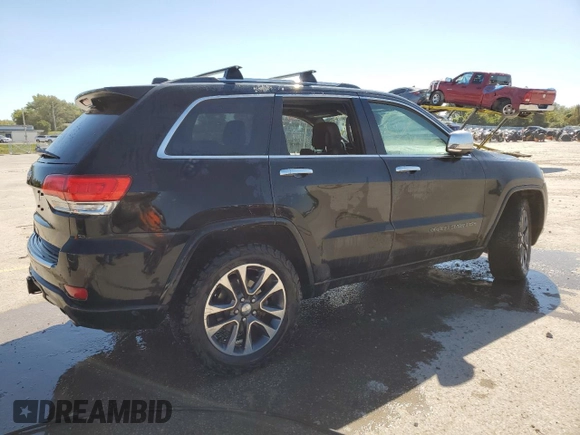 2017 Jeep Grand Cherokee Overland with VIN 1C4RJFCTXHC778491, listed as a Copart auction lot 73944594 with 99,235 mi miles and Clean Title. Bid and sale history available at carsss.com. Image 3.