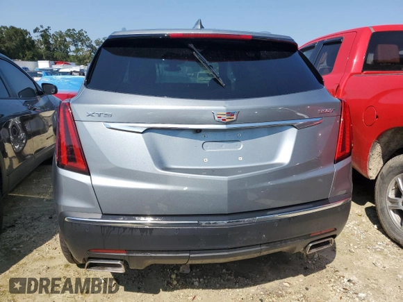 2023 Cadillac XT5 FWD Luxury z VIN 1GYKNAR4XPZ144533, wystawiony jako Copart lot #74734164 z przebiegiem Nie podano mil oraz Nie do naprawy • Non repairable. Historia ofert i sprzedaży dostępna na DreamBid. Obrazek 6.