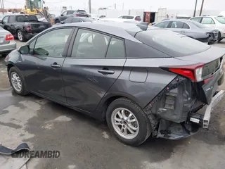 2021 Toyota Prius L Eco with VIN JTDKAMFU8M3144391, listed as a IAAI auction lot 42477718 with 314,346 mi miles and . Bid and sale history available at DreamBid. Image 3.