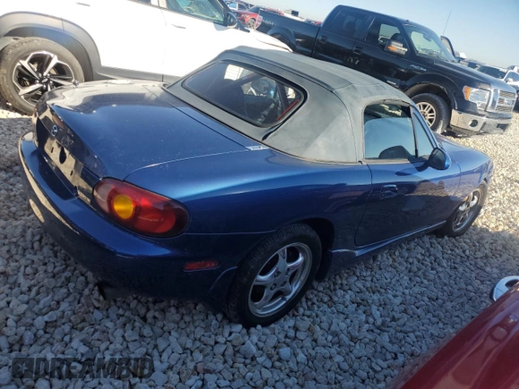 1999 Mazda MX-5 Miata with VIN JM1NB3532X0134801, listed as a Copart auction lot 83838374 with 97,015 mi miles and Salvage title. Bid and sale history available at DreamBid. Image 3.