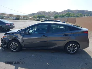 2021 Toyota Prius L Eco with VIN JTDKAMFU4M3144985, listed as a IAAI auction lot 42443957 with 20,816 mi miles and . Bid and sale history available at DreamBid. Image 14.