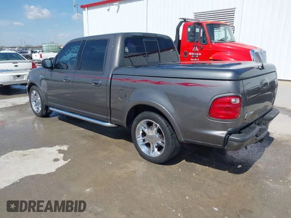 2002 Ford F-150 Harley Davidson with VIN 1FTRW07392KE11409, listed as a IAAI auction lot 41877998 with 148,476 mi miles. Bid and sale history available at carsss.com. Image 3.
