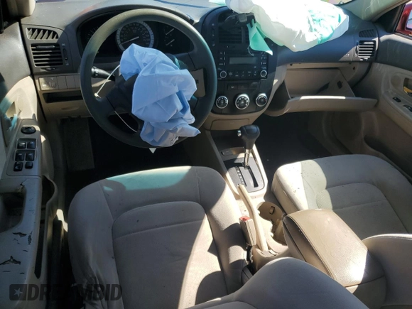 2007 Kia Spectra EX z VIN KNAFE121275436205, wystawiony jako Copart lot #57680055 z przebiegiem 141 670 mil mil oraz Szkoda całkowita • Salvage title. Historia ofert i sprzedaży dostępna na DreamBid. Obrazek 8.
