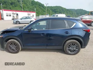 2021 Mazda CX-5 Touring z VIN JM3KFBCMXM0389857, wystawiony jako IAAI lot #42309650 z przebiegiem 49 938 mil mil oraz . Historia ofert i sprzedaży dostępna na DreamBid. Obrazek 14.