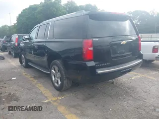2018 Chevrolet Suburban Premier with VIN 1GNSCJKC9JR100504, listed as a IAAI auction lot 42276280 with 153,916 mi miles and . Bid and sale history available at DreamBid. Image 3.
