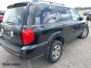2005 Honda Pilot EX-L with NAVI with VIN 2HKYF18715H562492, listed as a IAAI auction lot 41627194 with 184,653 mi miles. Bid and sale history available at carsss.com. Image 4.