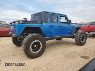 2021 Jeep Gladiator Rubicon with VIN 1C6JJTBM1ML611203, listed as a Copart auction lot 87203924 with 27,645 mi miles and Salvage title. Bid and sale history available at DreamBid. Image 3.