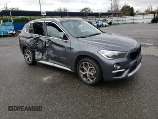 2018 BMW X1 xDrive28i with VIN WBXHT3C33J5K23187, listed as a Copart auction lot 71063192 with 97,403 mi miles. Bid and sale history available at carsss.com. Image 4.